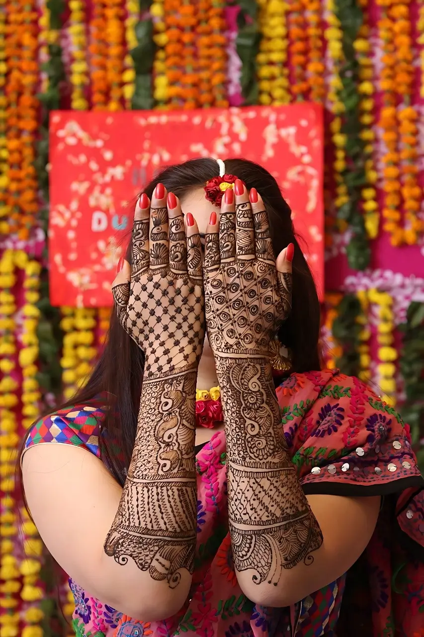 Close-up of beautifully intricate henna designs on hands and arms, showcasing the artistry of Bristol Beauty Line's henna services.